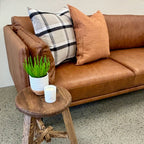 Hunter Leather Sofa in Caramel styled in a contemporary interior with complementary furniture and décor.