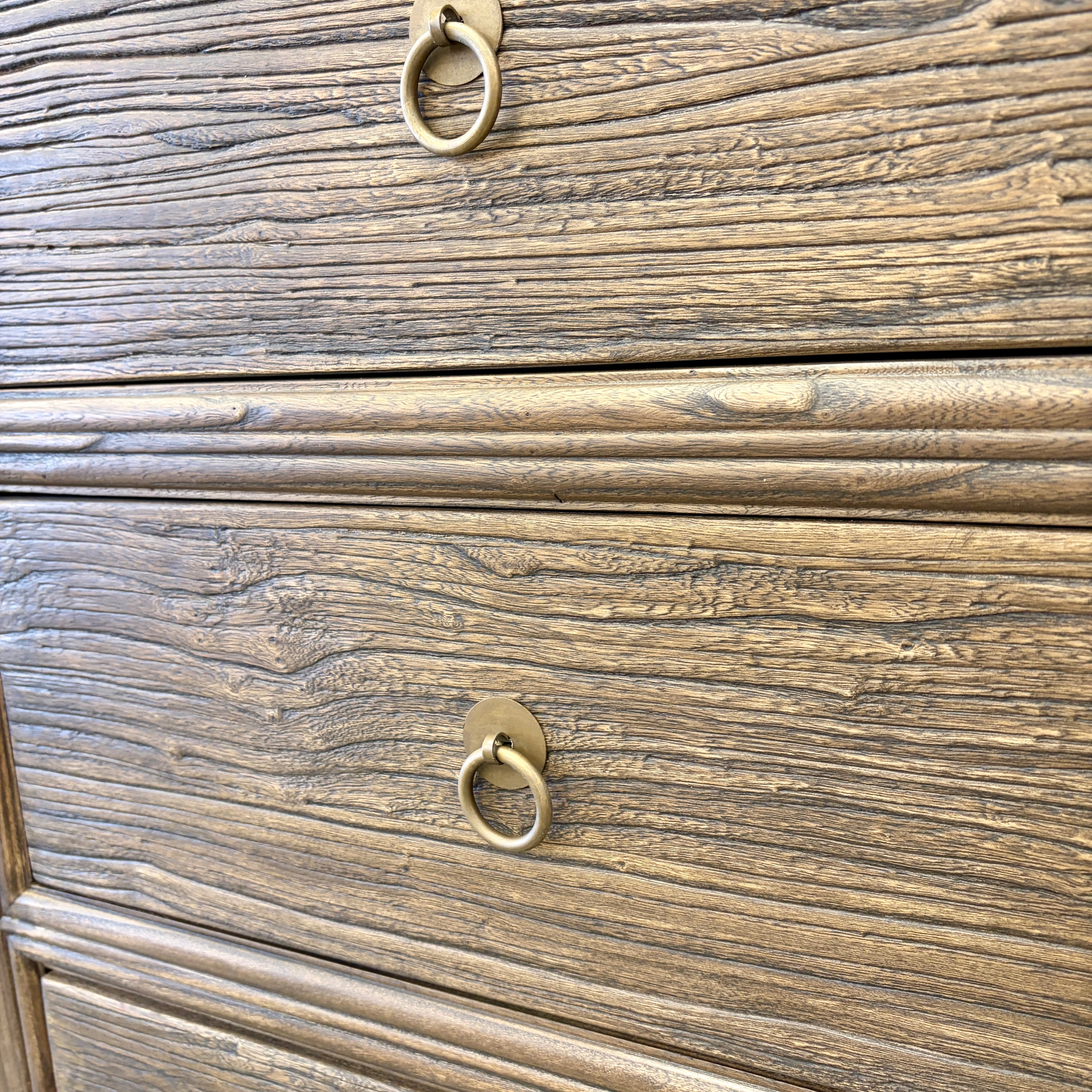 Close-up of the Jacob Sideboard drawer showing textured elm grain and brass-style ring handle