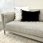 Angled styled view of the Josephine Sofa in Geo Black/White, highlighting its tailored cushions, textured upholstery and contemporary design.