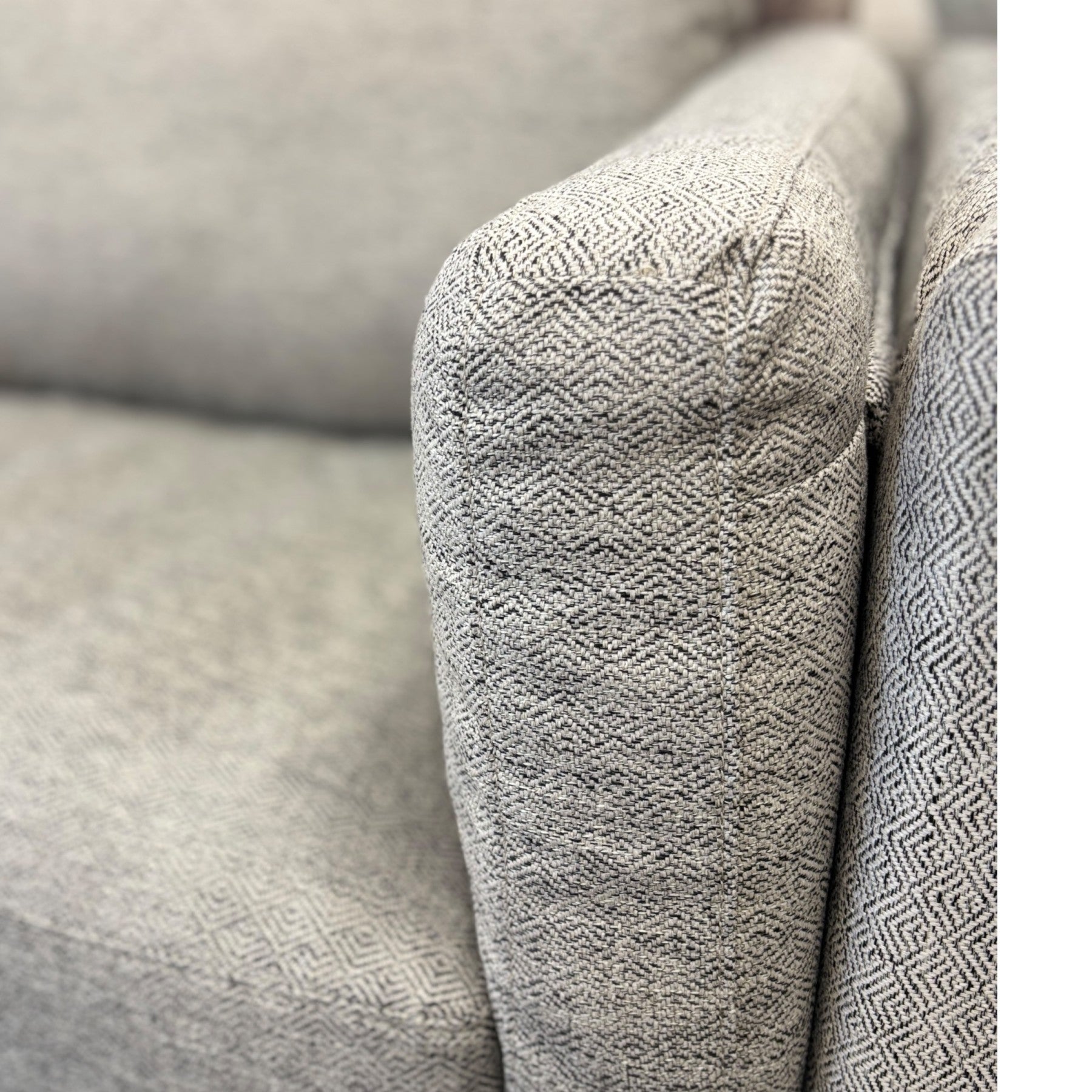 Close-up of the Josephine Sofa's Geo Black/White woven fabric, highlighting the textured upholstery and quality finish.