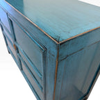 Close-up of Lola Sideboard showing distressed sky blue paintwork and timber grain detailing