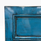Close-up of distressed Domican Blue finish on Loui Sideboard