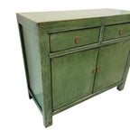 Angled view of Loui Sideboard in olive green showing compact two-door cabinet design
