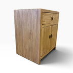 Side view of the Lydia Bedside showing the natural elm timber grain and compact cabinet design