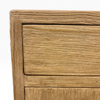 Close-up of the Lydia Bedside showing the natural elm timber grain and framed drawer detail
