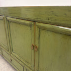 Close-up of Margot Sideboard in Olive showing distressed finish and brass hardware