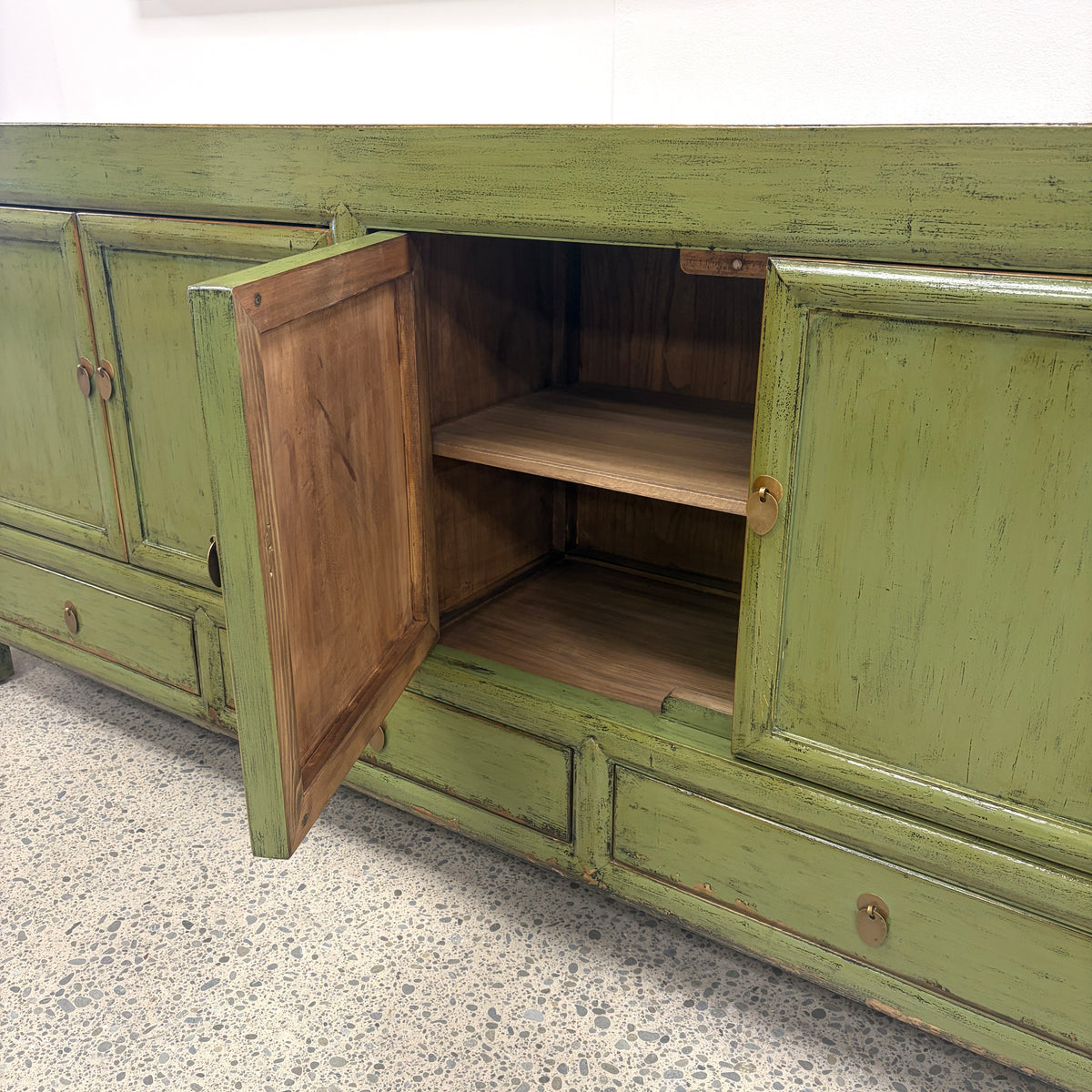 Margot Sideboard in Olive with cupboard open showing internal shelving