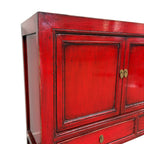 Margot Sideboard Pomegranate side view showing distressed red finish and panelled door detail