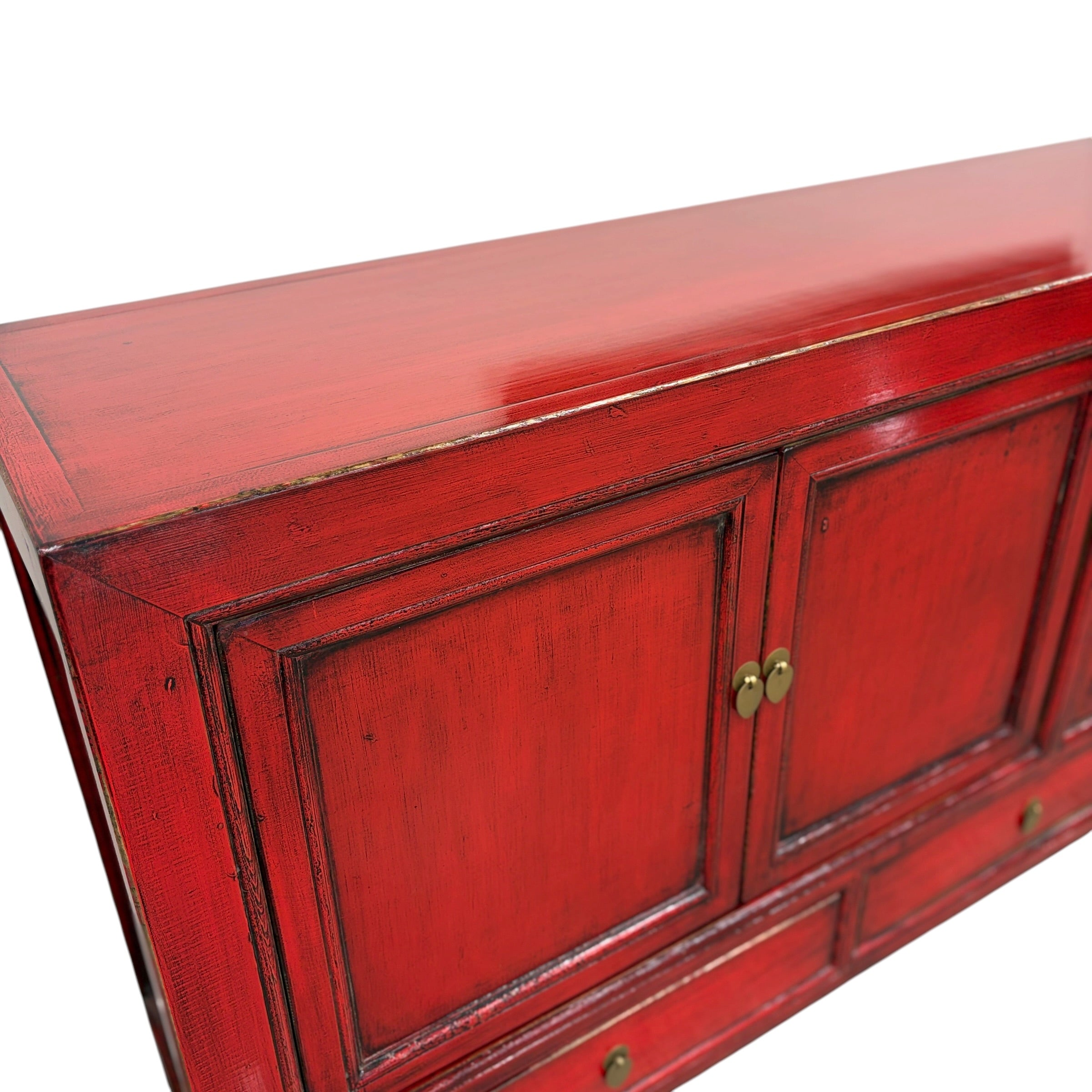 Angled view of Margot Sideboard in Pomegranate showing top, doors and brass toned handles
