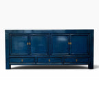 Margot Sideboard in Prussian Blue with four cupboard doors, three drawers and brass-toned handles