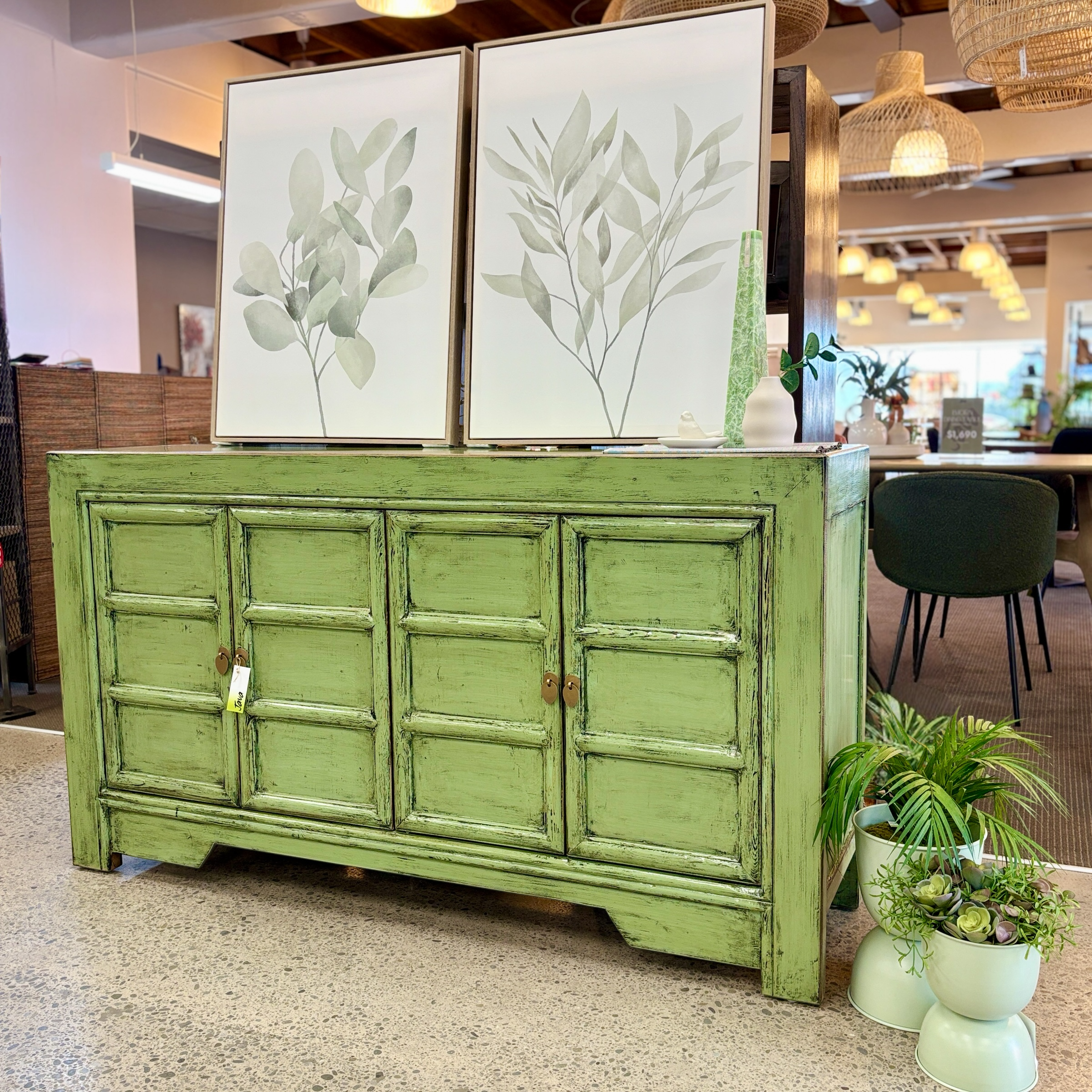 Maria Sideboard in spring green styled in a contemporary interior with botanical artwork