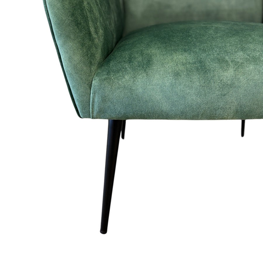 Close-up of the Marla Chair's slim black metal leg, showcasing the clean contemporary design and quality craftsmanship.