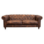 Maxwell Chesterfield sofa in brown leather styled in a contemporary living room.