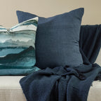 Milano Cushion in Diesel blue styled with patterned cushion and coordinating throw
