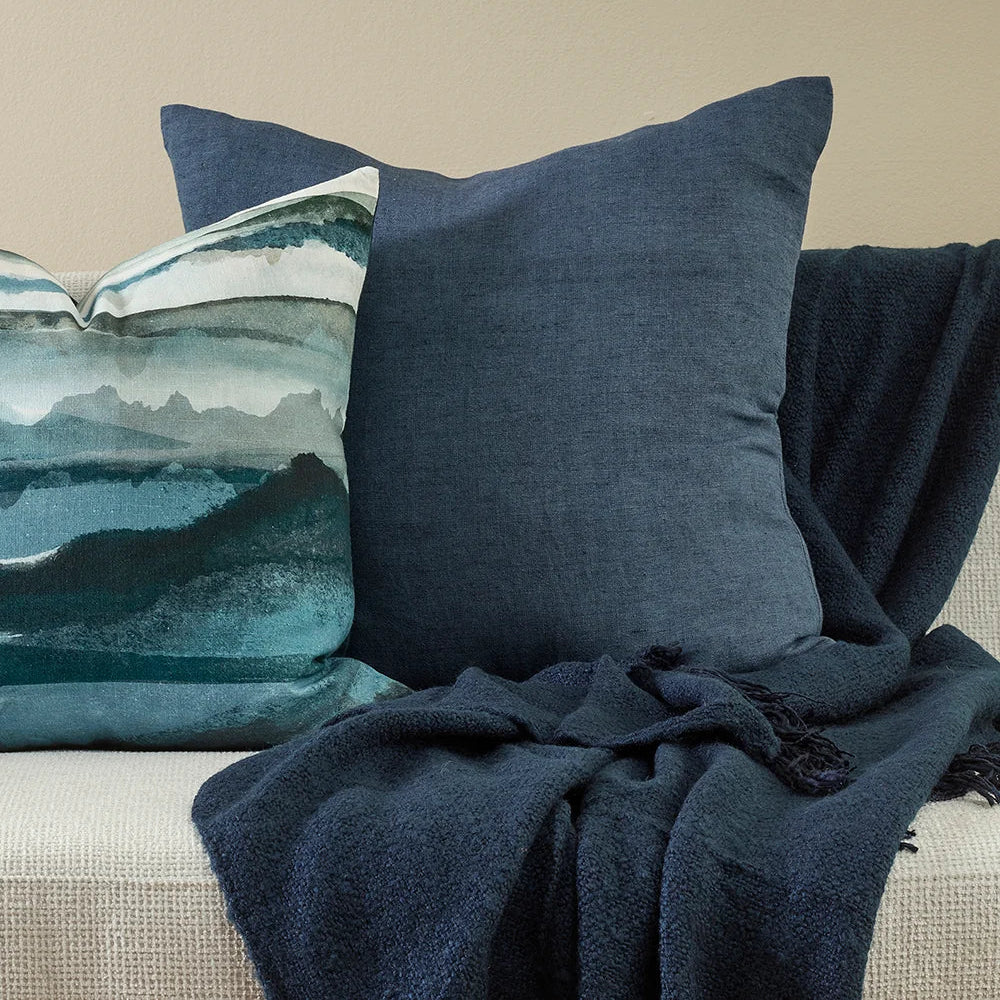 Milano Cushion in Diesel blue styled with patterned cushion and coordinating throw