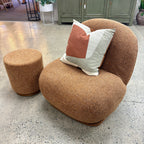 Milo Swivel Chair in Copper styled in a contemporary living room with complementary furniture and décor.