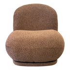 Side profile of the Milo Swivel Chair in Copper, showcasing its rounded silhouette and generously cushioned seat.