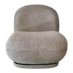 Milo Swivel Chair in Latte with a sculptural curved design, textured upholstery and smooth swivel base.