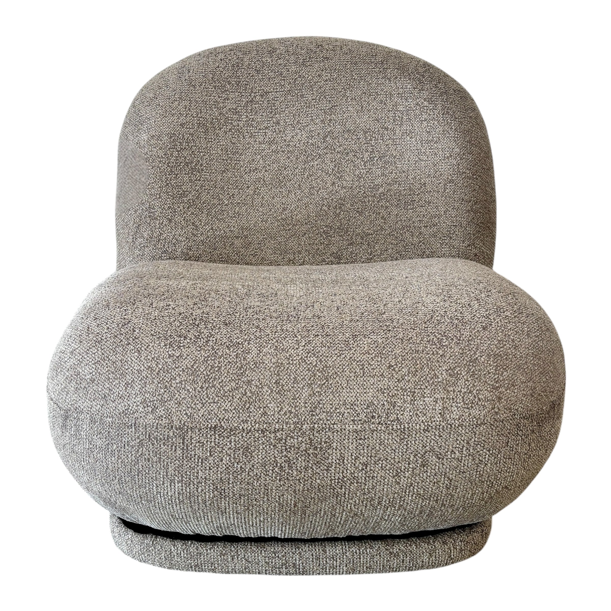 Milo Swivel Chair in Latte with a sculptural curved design, textured upholstery and smooth swivel base.