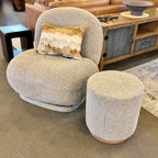 Milo Swivel Chair in Latte styled in a contemporary living room with complementary furniture and décor.