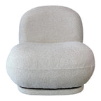 Milo Swivel Chair in Salt with a sculptural curved design, textured upholstery and smooth swivel base.