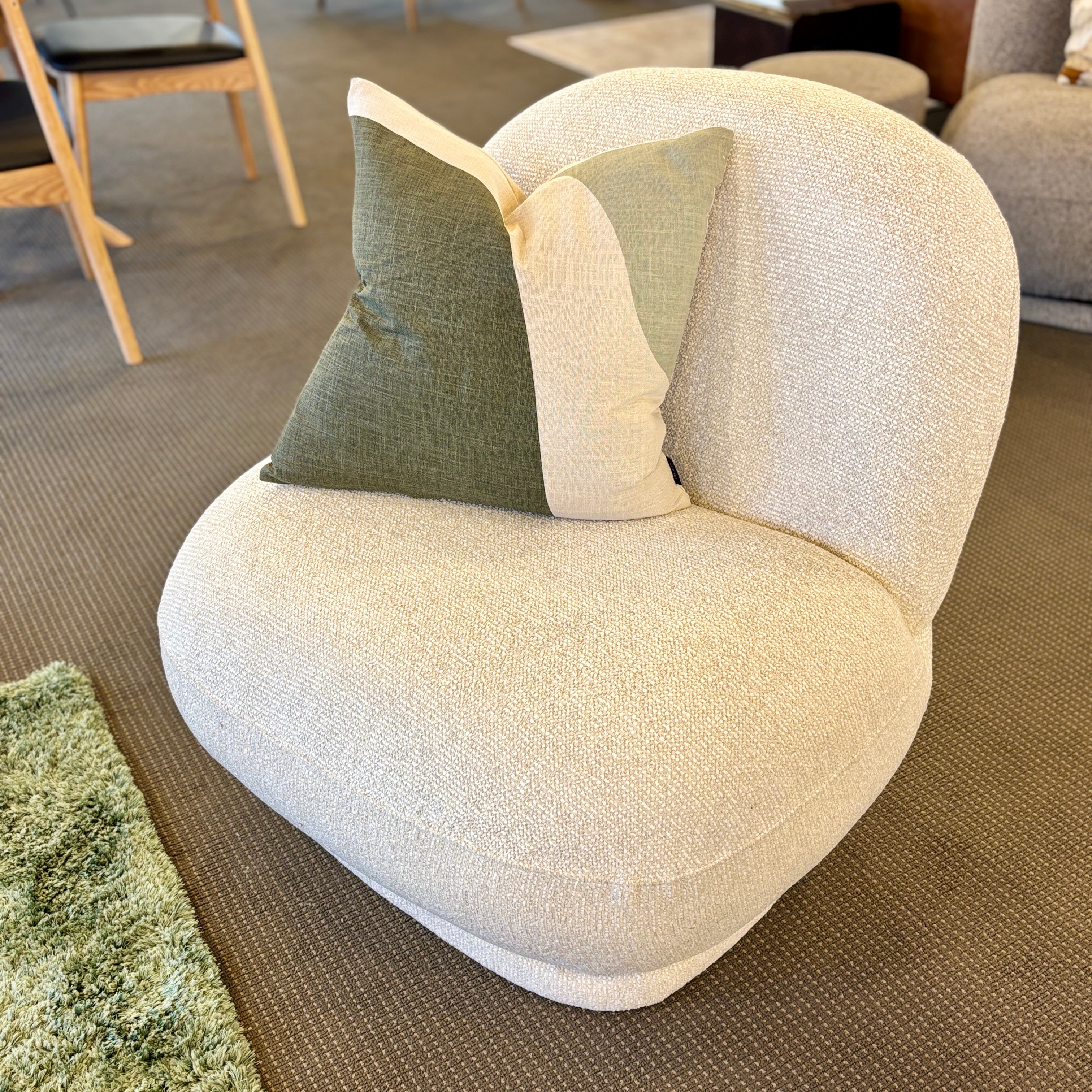 Milo Swivel Chair in Salt styled in a contemporary living room with complementary furniture and décor.