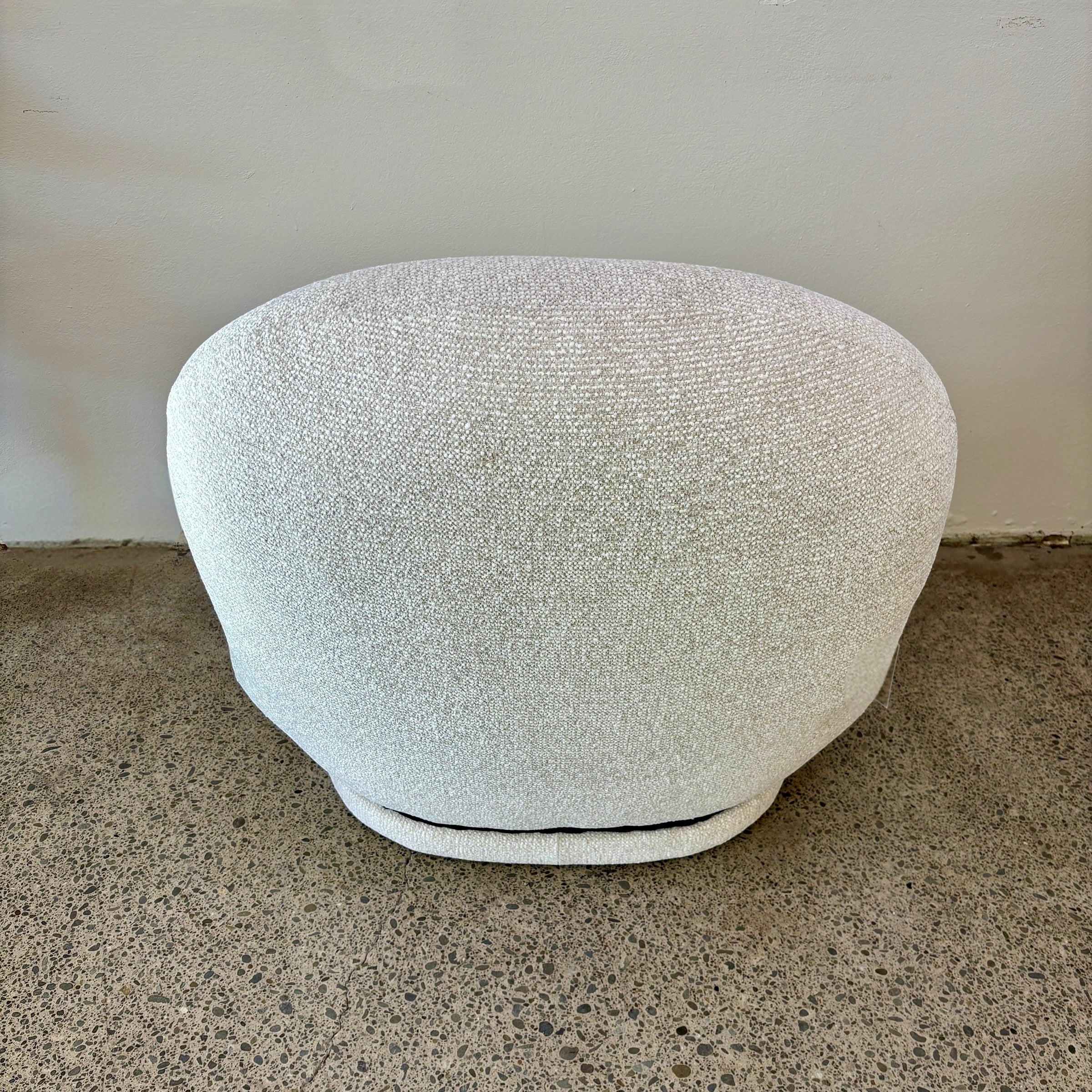 Curved back of milo swivel chair in salt.  Comfortable and modern.