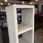 Wooden display cabinet in a room with shelves and lights