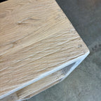 Close-up of a wooden surface with visible grain and texture.