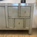 Close-up of drawers and brass-toned handles on the Morocco Sideboard in glossy grey