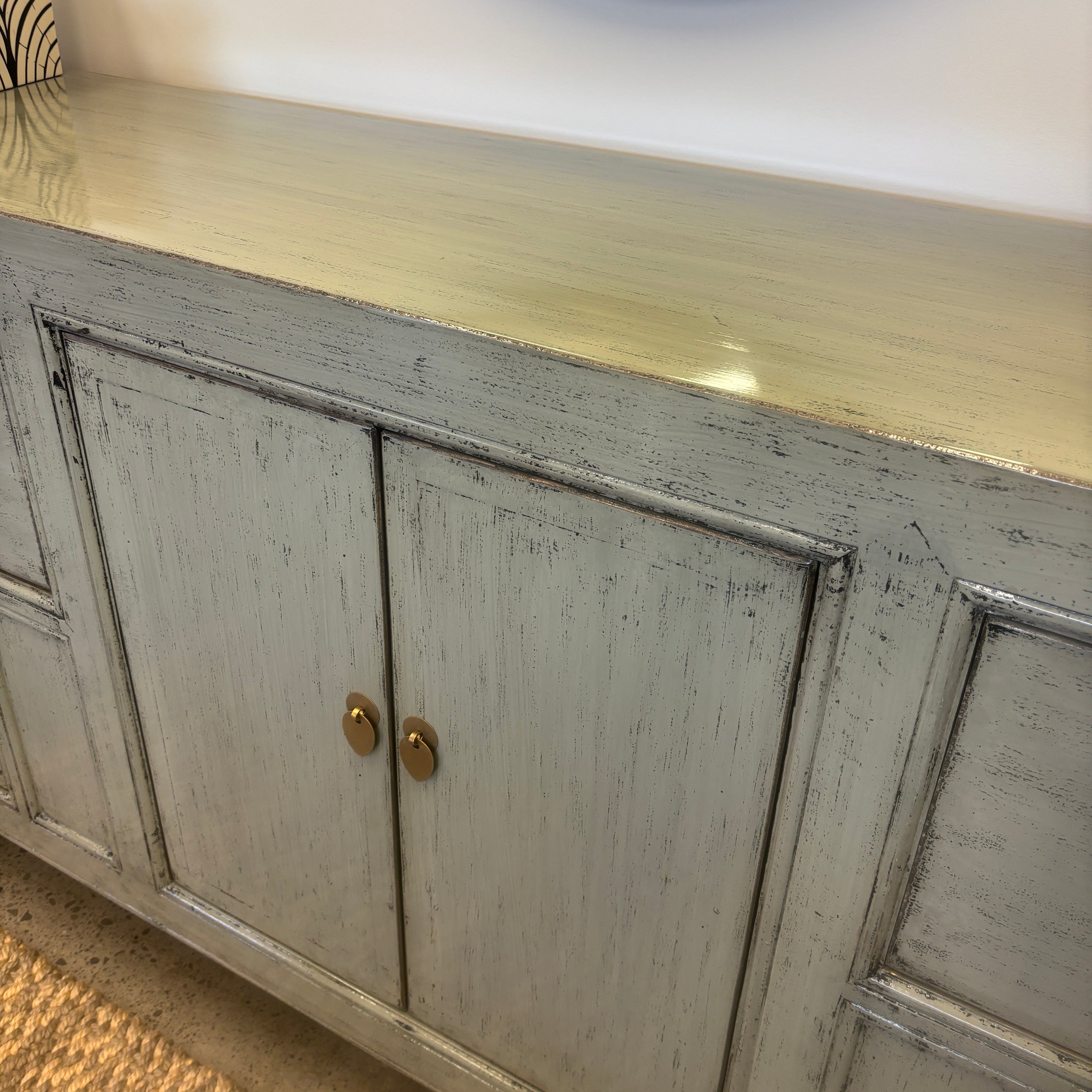 Close-up of the glossy grey timber finish and brass-toned hardware on the Morocco Sideboard