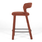 Side view of Munich Bar Stool in textured rust-burgundy fabric