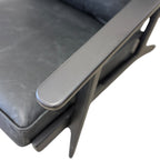 Overhead view of the Nero armchair in black leather, showing the generously padded seat and black frame.