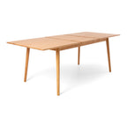 Nordik Extension Dining Table opened to accommodate the extension leaf, showing the practical extending mechanism and Scandinavian styling.