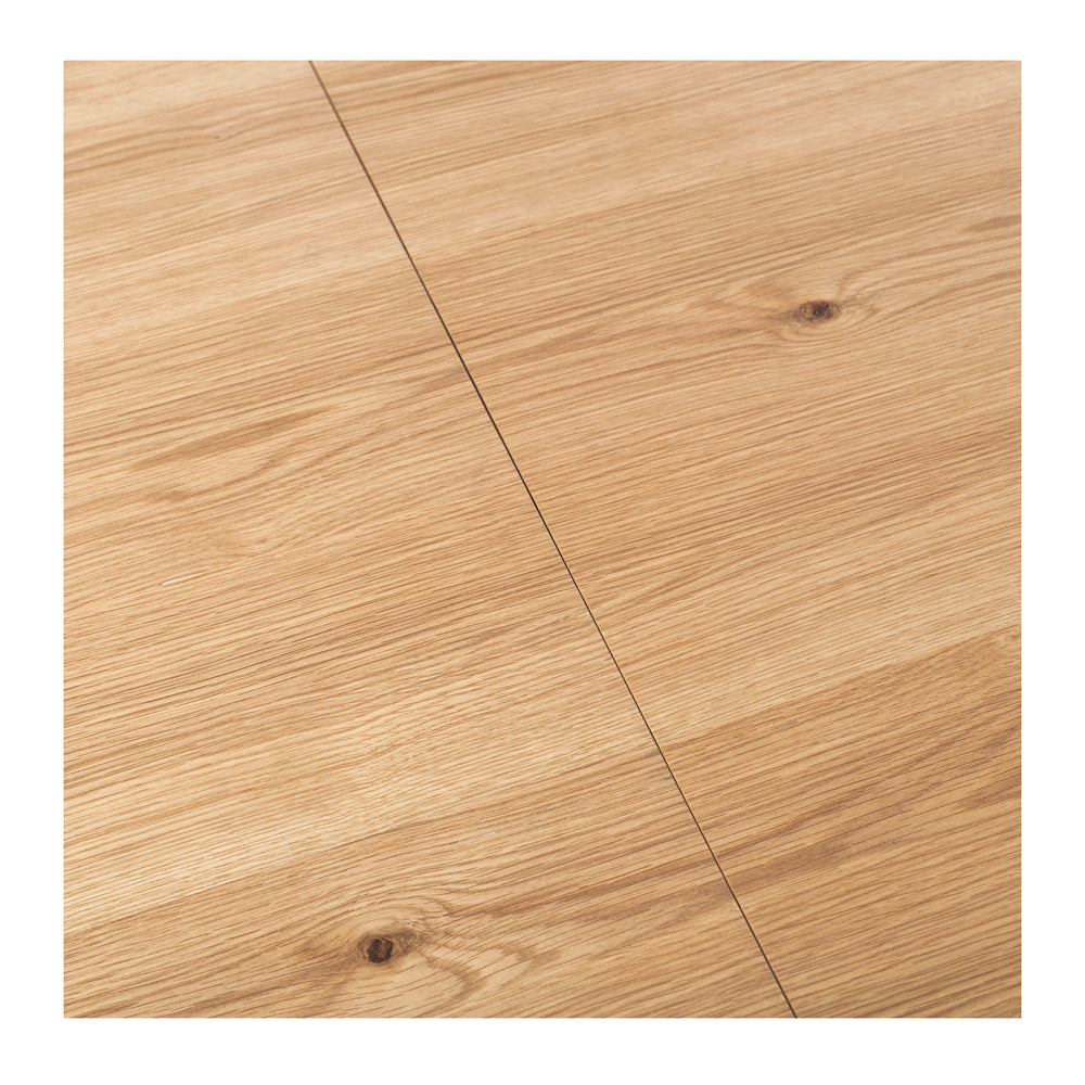 Close-up of the Nordik Extension Dining Table's solid oak tabletop, highlighting the natural timber grain and matt protective finish.