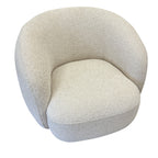 Angled view of the Nova Chair in Salt, showcasing its wraparound curved design and contemporary silhouette.