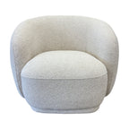 Nova Chair in Salt with a sculptural curved design, cocoon-style backrest and textured fabric upholstery.