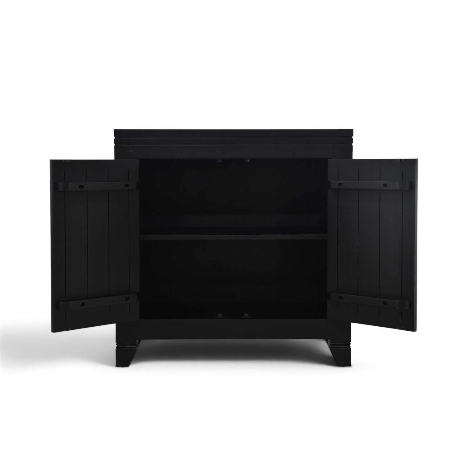 Interior of the Oriental Cabinet in black mango wood, showing the spacious storage area and adjustable internal shelf.