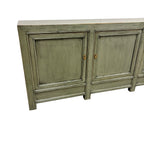 Angled view of Patrick Sideboard showing three panelled doors and long timber top