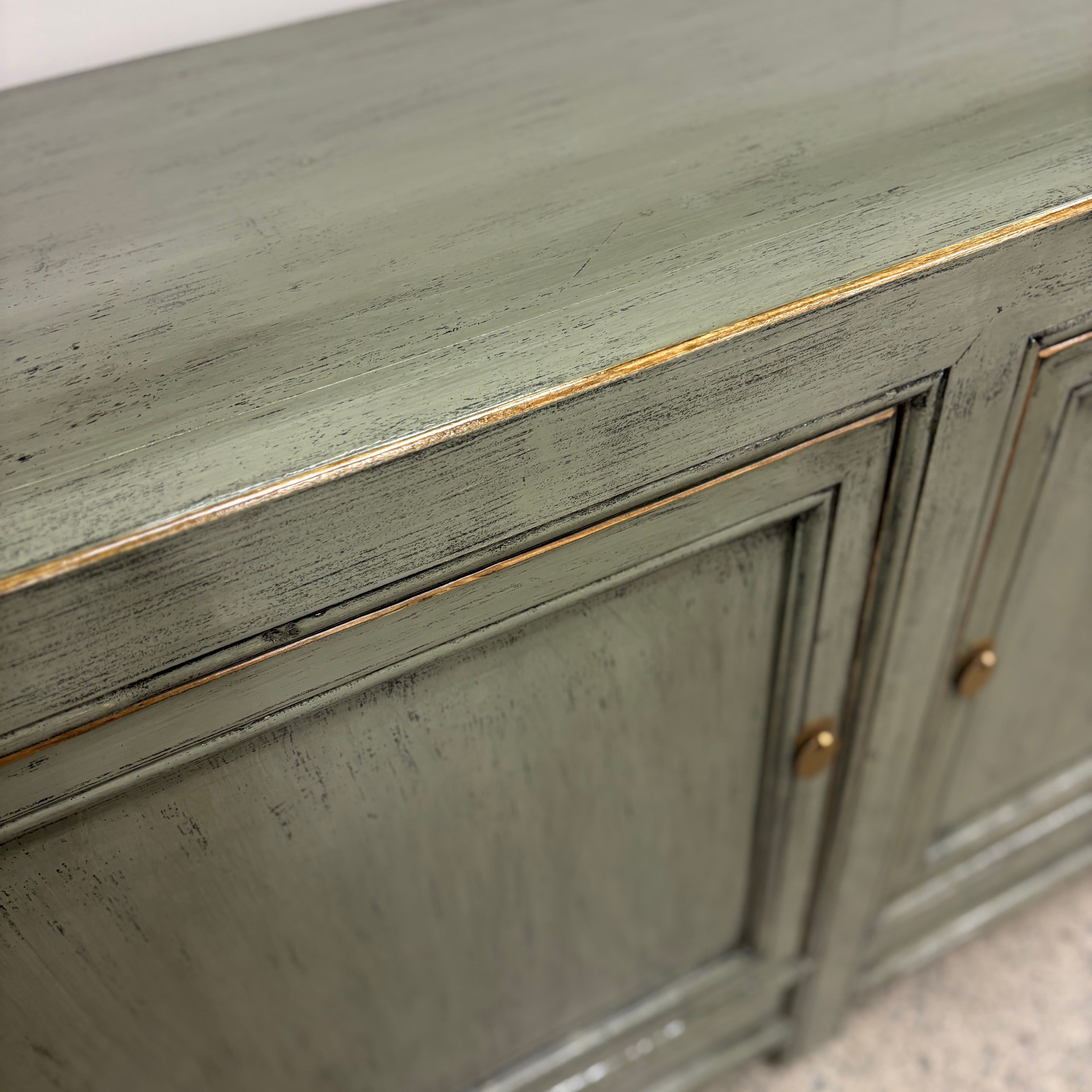 Close-up of Patrick Sideboard showing smoke timber finish, subtle distressed detailing and brass-toned handle
