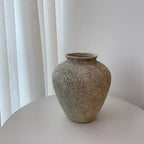 Petros ceramic vase with rounded shape and textured neutral finish