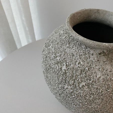 Close-up of Petros ceramic vase showing its textured stone-effect finish