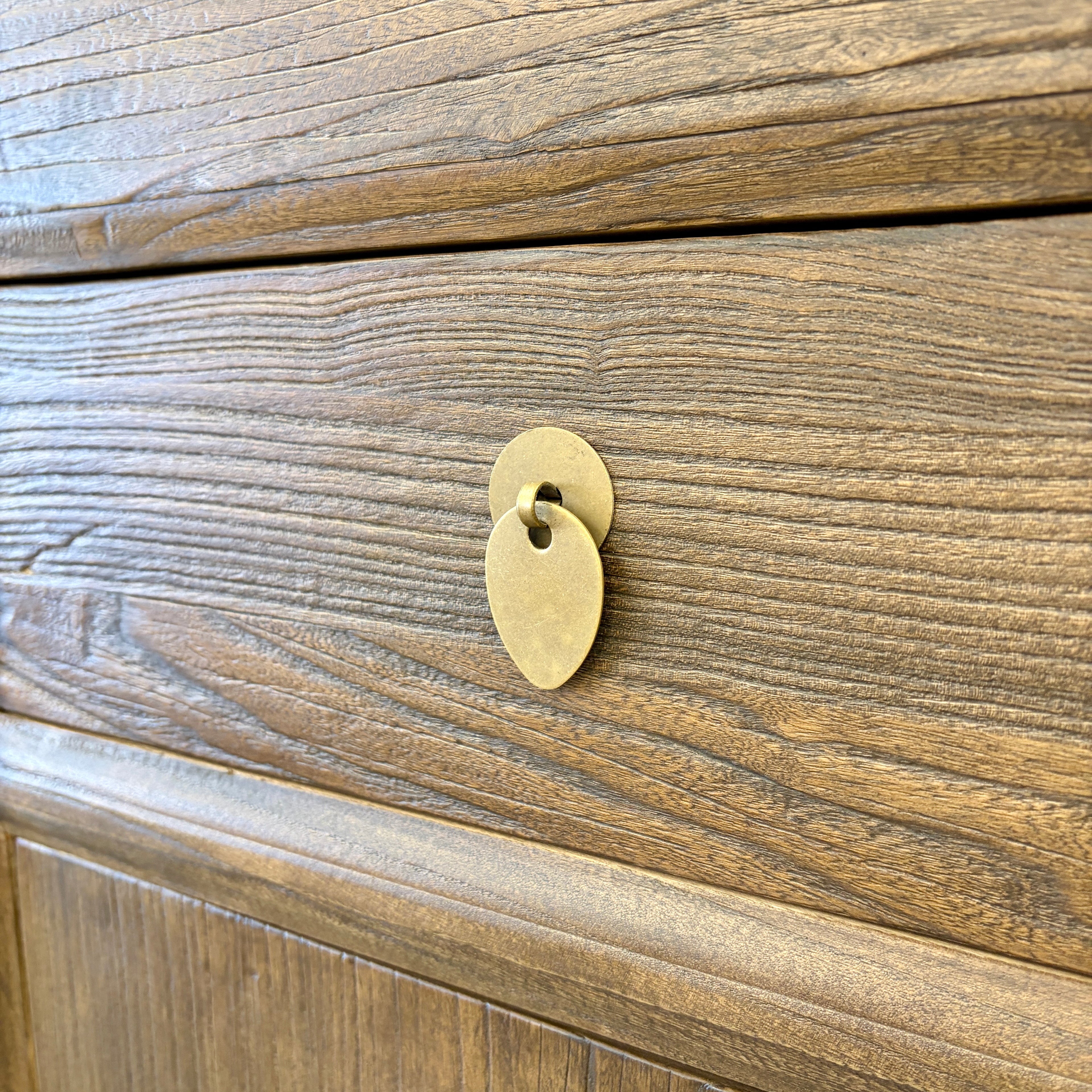 Close-up of the Quinn Sideboard in Canadian Brown Elm showing natural timber grain and antique brass-style drop handle