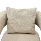 Close-up of the Reyna Chair's generously padded seat, showcasing the textured upholstery and quality craftsmanship.
