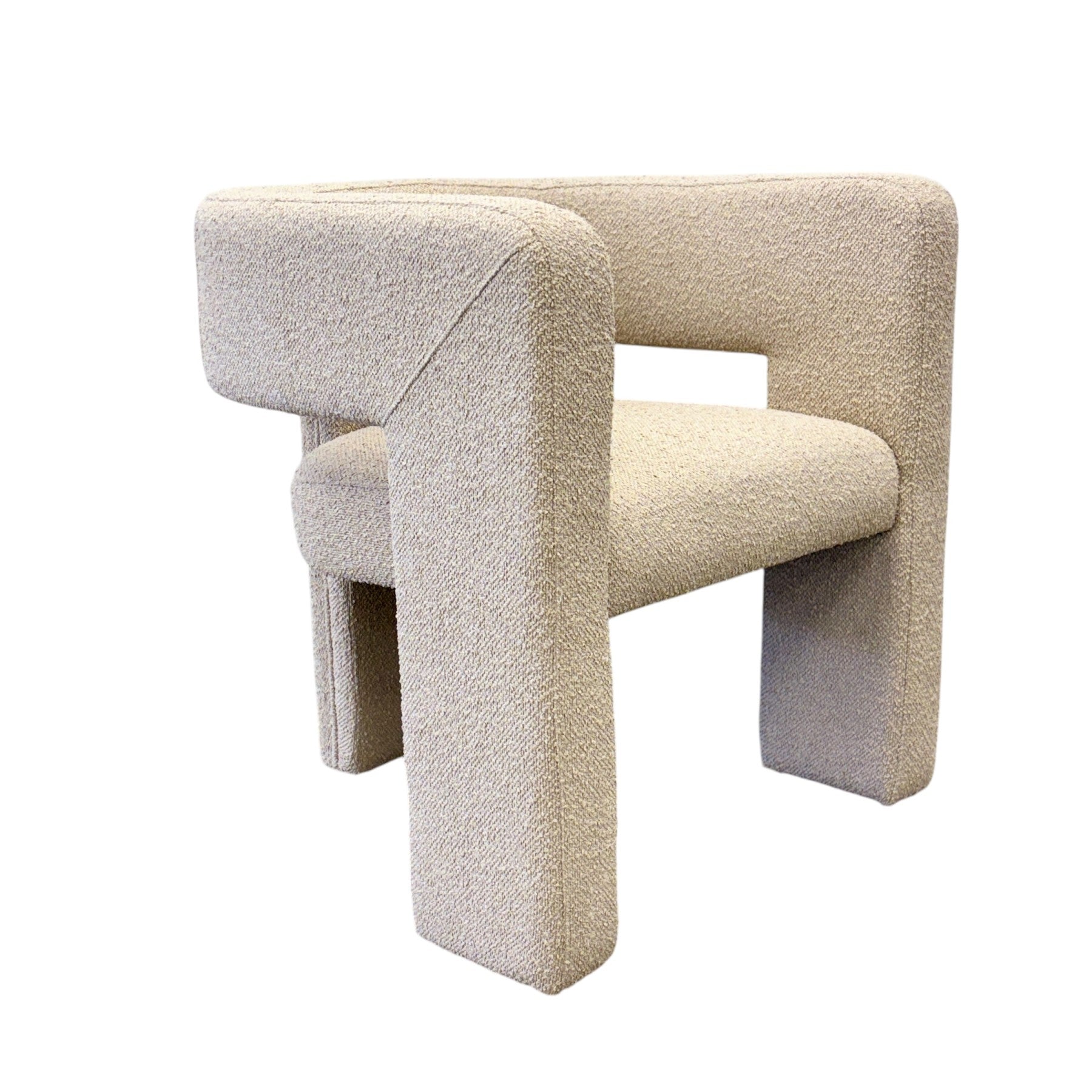 Side profile of the Reyna Chair in Bone, showcasing its sculptural wraparound arms, curved silhouette and contemporary design.