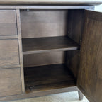 Rocco Sideboard with door open showing spacious shelved storage inside