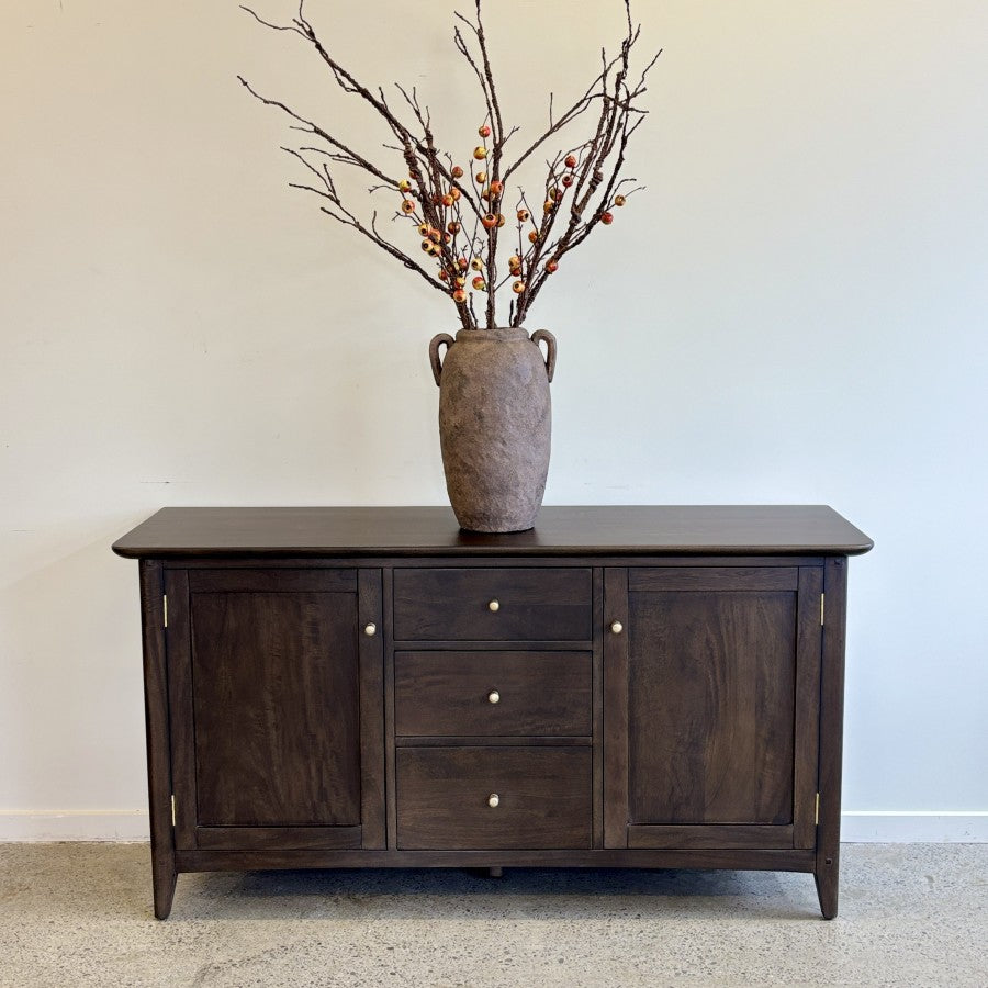 Rocco 3 Drawer Sideboard in warm iron brown mango wood styled with a decorative vase