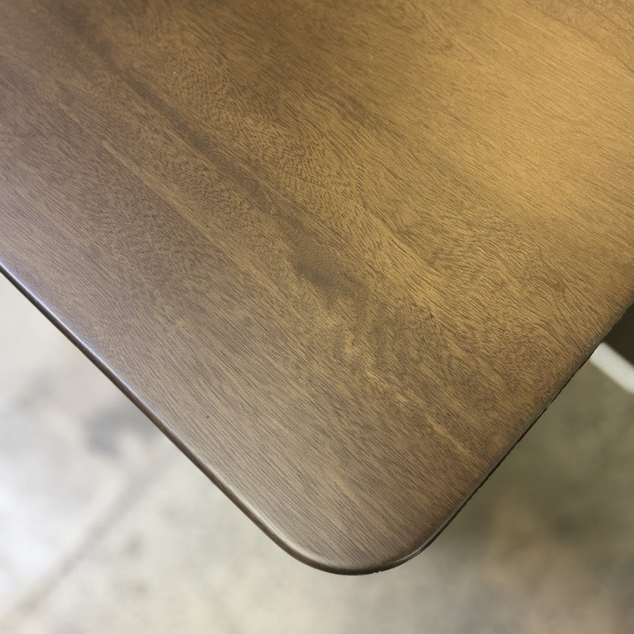 Close-up of the mango wood grain and warm iron brown finish on the Rocco Sideboard