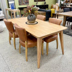 Rocco Dining Table in Natural styled with contemporary dining chairs, showcasing its solid mango wood construction and warm timber finish.