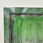 Close-up of the Rosa Sideboard showing its layered distressed emerald green finish